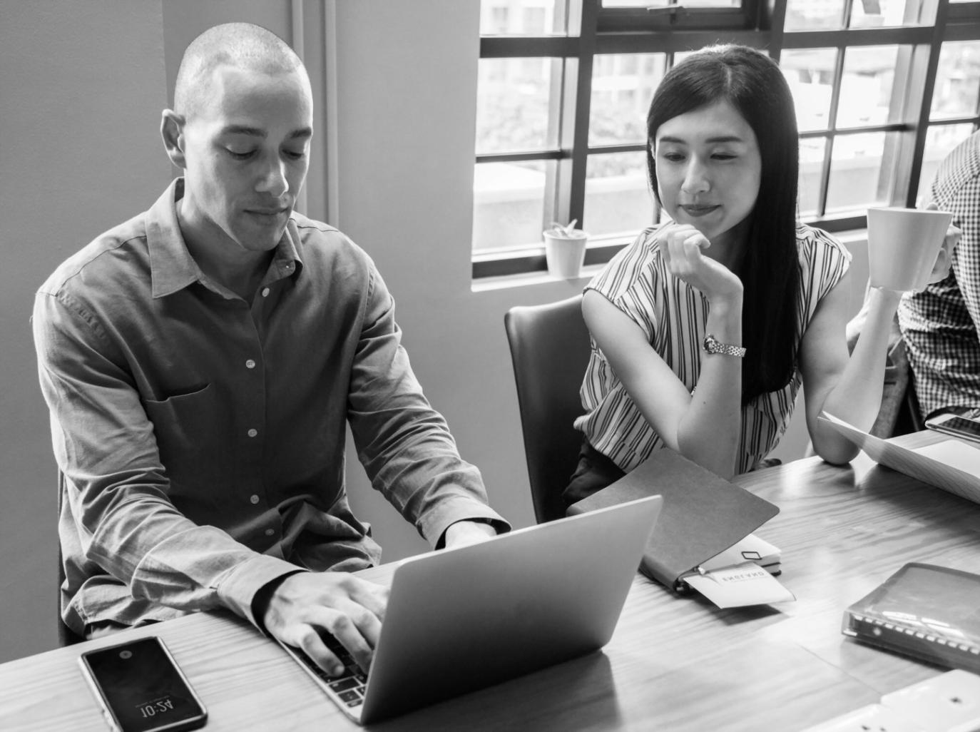 Financial analysts reviewing market data
